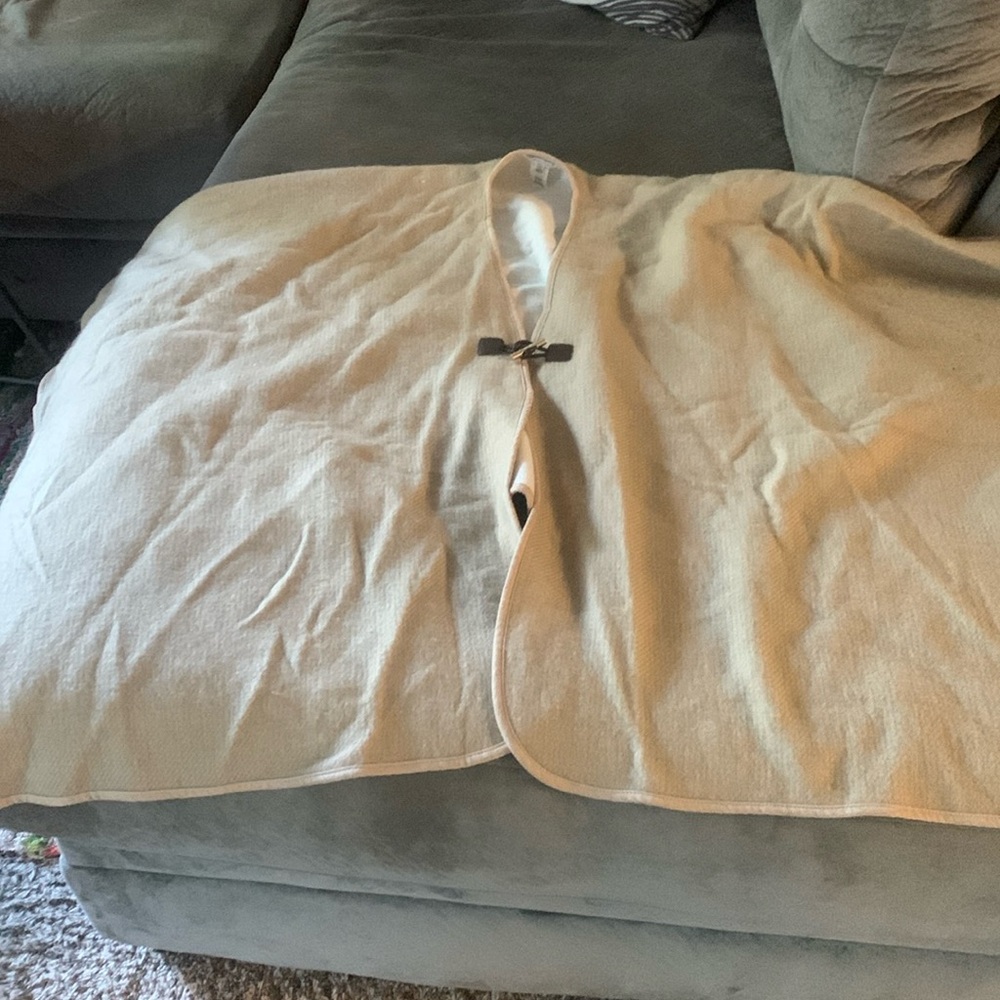 Calvin Klein Classy shawl will pair well with a white tee and jeans